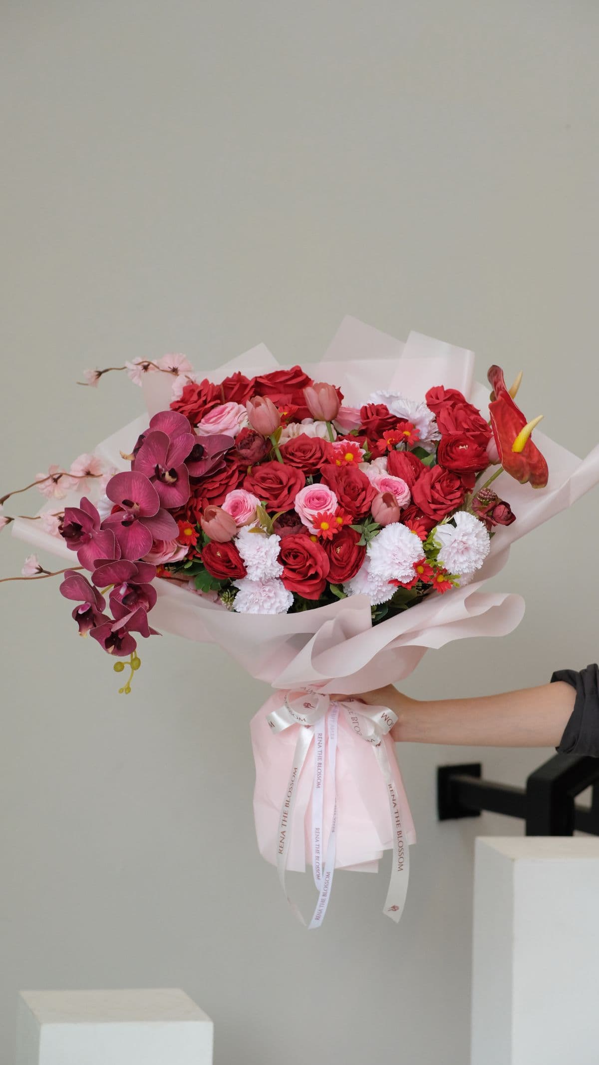 Scarlett Dragon - Artificial red roses, orchid & ranunculus — bold, textural, dramatically beautiful. - Rena The Blossom Jakarta