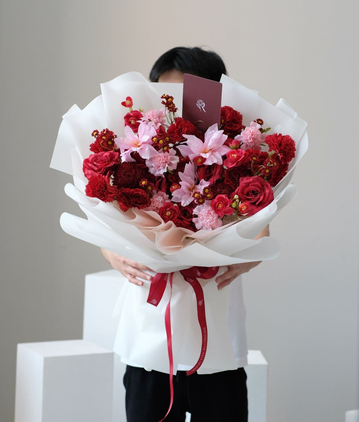 Petal Reverence - Red roses, daisy, flamingo & scabiosa — an artificial arrangement of unforgettable warmth. - Rena The Blossom Jakarta
